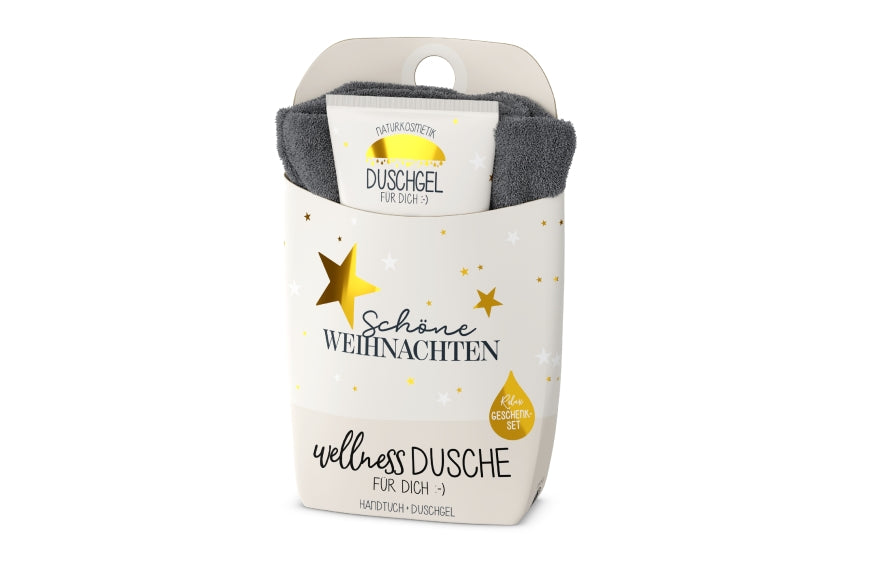 Wellnessdusche „Schöne Weihnachten“ – Handtuch & Naturkosmetik-Duschgel in weißer Verpackung mit goldenen Sternen