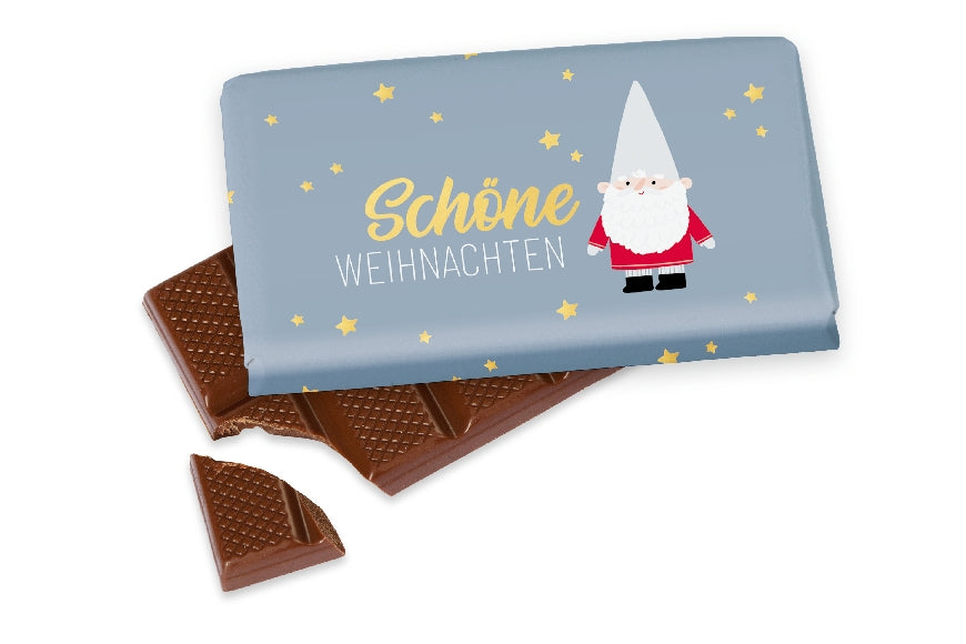 Vollmilchschokolade mit Aufschrift „Schöne Weihnachten“ und süßem Weihnachts-Zwerg-Motiv von Geschenk für Dich.