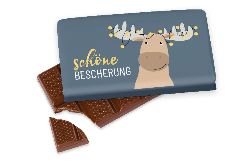Vollmilchschokolade mit Aufschrift „Schöne Bescherung“ von Geschenk für Dich, mit witzigem Weihnachts-Elch-Motiv.