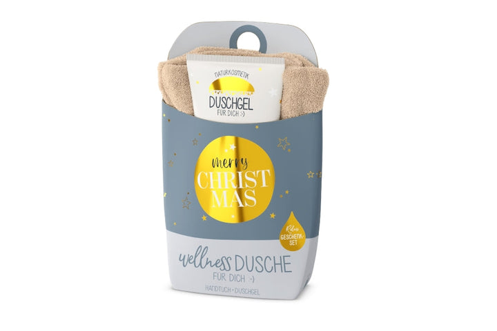 Wellnessdusche „Merry Christmas“ – Handtuch &amp; Naturkosmetik-Duschgel in grauer Verpackung mit goldenem Kreis und Sternen