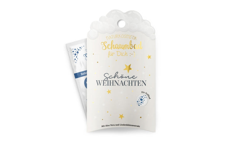 Naturkosmetik-Schaumbad „Schöne Weihnachten“ in weißer Verpackung mit goldenen Sternen