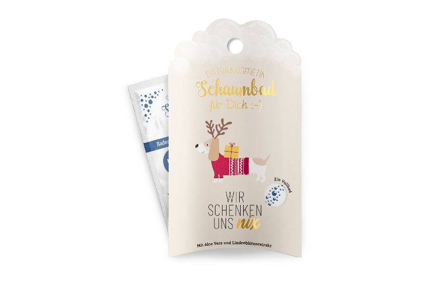 Geschenk für Dich Naturkosmetik Schaumbad mit Weihnachts-Dackel Motiv & Aufschrift „Wir schenken uns nix“.