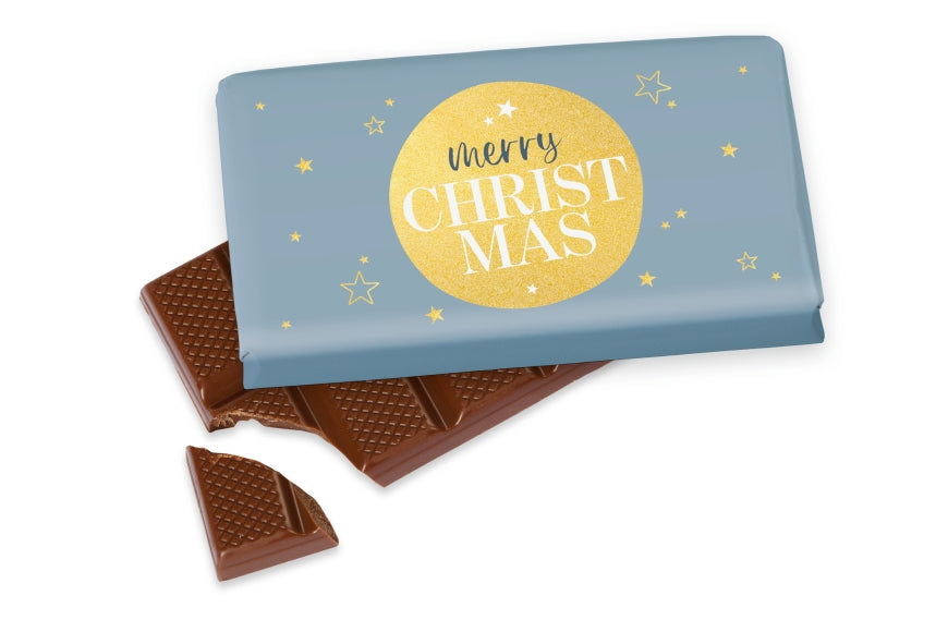 Weihnachtsschokolade mit Spruch Merry Christmas, blau mit goldener Kugel und Sternen, Vollmilch 40 g – Geschenk für Dich