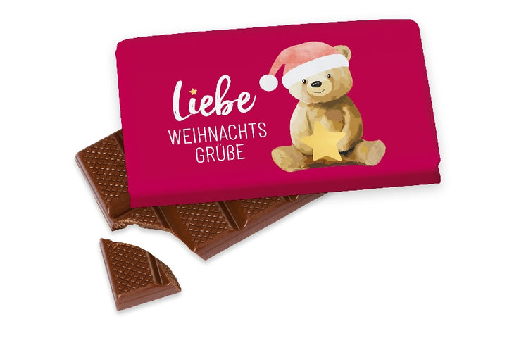 Kleine Vollmilchschokolade (40 g) mit süßem Weihnachtsbär-Motiv & Aufschrift „Liebe Weihnachtsgrüße“ von Geschenk für Dich